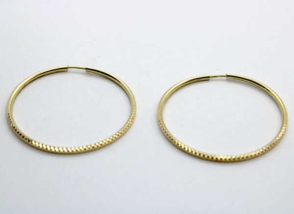 Argollas. Aros labradas en Oro 18 k